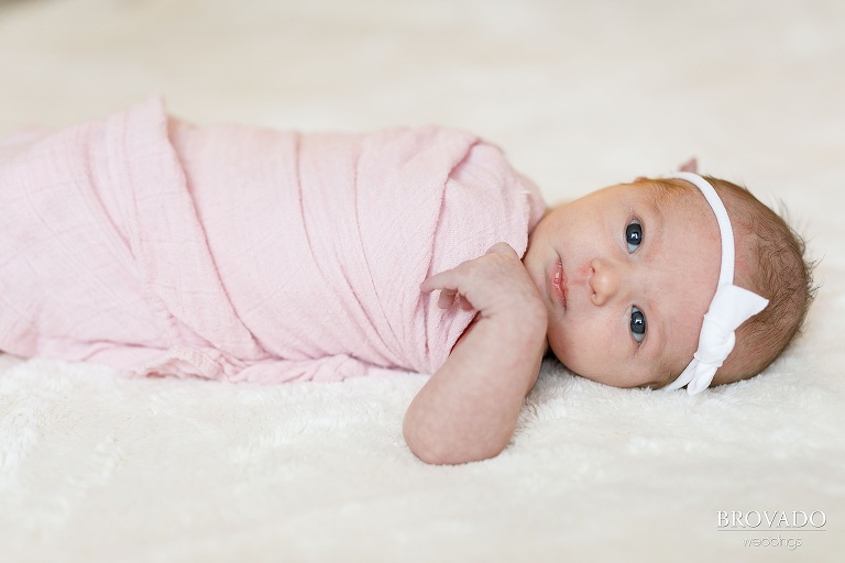 sweet close-up newborn photo in a pink blanket